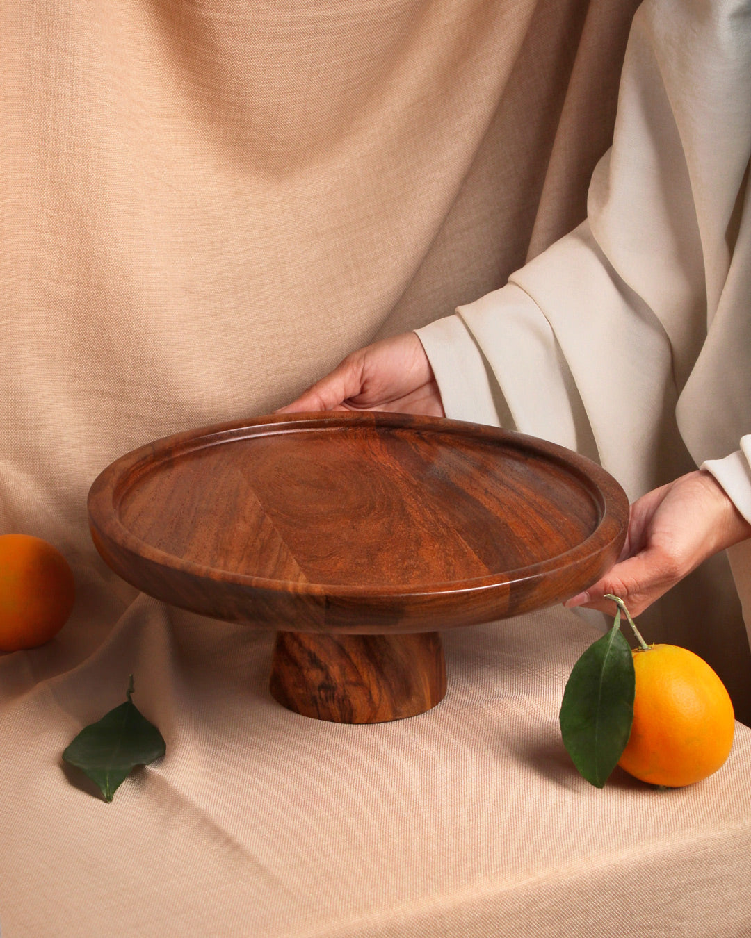 Handmade wooden cake stand for cakes and desserts, crafted from natural wood.