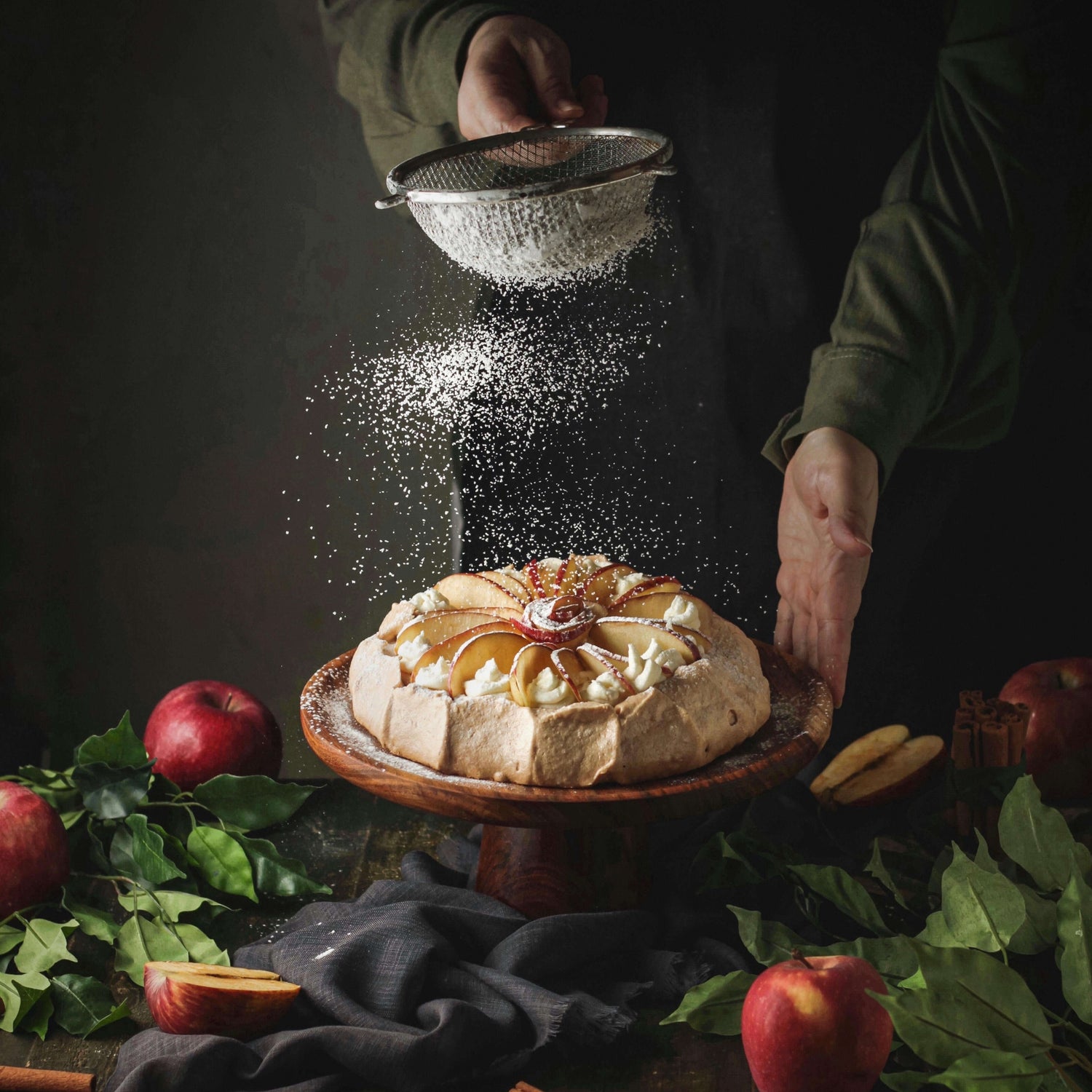 "Versatile natural wood cake stand showcasing an apple cake, a timeless choice for creating memorable moments on your special day."